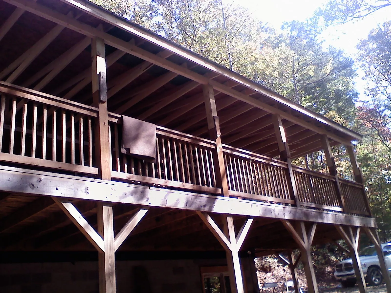 Timber framing under a new elevated porch and deck — Roof Leak Repair in North Greece by Roofing Brothers